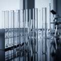 Behind them, additional laboratory equipment is visible, including a microscope Royalty Free Stock Photo