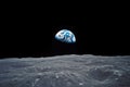 Behold the breathtaking image of Earth as seen from the surface of the moon, An awe-inspiring view of Earth from