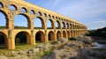 ncient Mastery: Roman Aqueduct Majesty Spanning the Gentle River