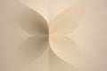 Beige abstract background featuring a butterfly or flower shape, enhanced by soft lighting and smooth curves, creating a delicate Royalty Free Stock Photo