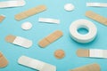 Beige adhesive bandages on blue background. Medical plasters Royalty Free Stock Photo