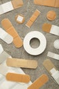 Beige adhesive bandages on grey background. Medical plasters Royalty Free Stock Photo