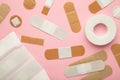 Beige adhesive bandages on pink background. Medical plasters Royalty Free Stock Photo