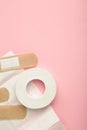 Beige adhesive bandages on pink background. Medical plasters Royalty Free Stock Photo