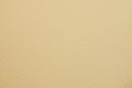 Beige background in a speck Royalty Free Stock Photo