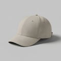 A beige baseball cap placed on a flat, neutral background. The cap features a curved Royalty Free Stock Photo