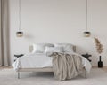 Beige bedroom with a large bed, rattan chandeliers, marble be