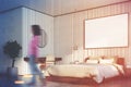 Beige bedroom with large poster close up side girl Royalty Free Stock Photo