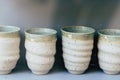 Beige and blue pottery cups