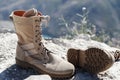 Beige boots with laces and soles on a nature background Royalty Free Stock Photo