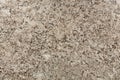 Beige and brown granite surface texture. Royalty Free Stock Photo