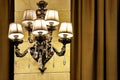 Beige brown vintage chandelier sconce on the wall