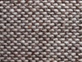 Beige-brown woven fabric, close-up. A sample of handcraft work.