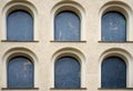 Beige building with many black windows Royalty Free Stock Photo