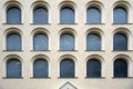 Beige building with many black windows Royalty Free Stock Photo