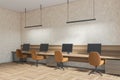 Beige business room interior with seats, table with pc in row Royalty Free Stock Photo