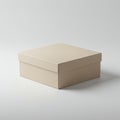 A beige cardboard box with a detachable lid is centered on a white surface. The box Royalty Free Stock Photo