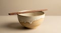 Beige ceramic bowl with a glossy white glaze dripped over the rim. Two wooden Royalty Free Stock Photo