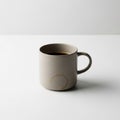 Beige ceramic mug filled with black coffee on a plain white surface Royalty Free Stock Photo