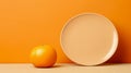 Beige ceramic plate and orange on the background of an empty orange wall. Mockup. Copy space.