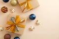 Beige Christmas background with golden, bronze, blue baubles decoration and gift boxes. Christmas holiday celebration, winter, New Royalty Free Stock Photo