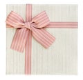 Beige Christmas present with pink ribbon, isolated, top view