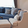 Beige classic sofa and blue pattern pillows in living room Royalty Free Stock Photo