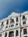 Beige classical facade of building in central district downtown Madrid, Spain. Vertical photo Royalty Free Stock Photo