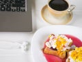 Beige coffee Cup and toasted French bread with curd cream, plum jam and orange zest. Royalty Free Stock Photo