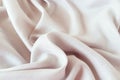 Beige color natural silk draped with folds, top view, fabric texture Royalty Free Stock Photo