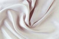 Beige color natural silk draped with folds, top view, fabric texture Royalty Free Stock Photo