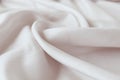 Beige color natural silk draped with folds, top view, fabric texture Royalty Free Stock Photo