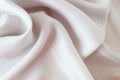 Beige color natural silk draped with folds, top view, fabric texture Royalty Free Stock Photo