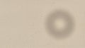 A beige-colored paper background featuring a subtle, circula Royalty Free Stock Photo