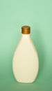 Beige container cosmetic plastic bottle for gel, lotion, cream, shampoo, bath foam on green background. Cosmetic Royalty Free Stock Photo
