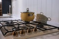 Beige cooking pot on the gas stove in traditional kitchen interior Royalty Free Stock Photo