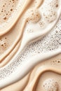 Beige cream streaks on white backdrop. Cosmetic emulsion surface close up. Light liquid textures flow with foam. Smooth layer with Royalty Free Stock Photo