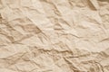 Beige crumpled paper wrinkled texture background