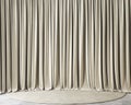 Beige draping curtains.