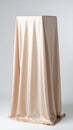 Beige Fabric Draped Over a Hidden Object Royalty Free Stock Photo