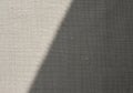 A beige fabric surface with a diagonal shadow. The textile\'s texture is Royalty Free Stock Photo