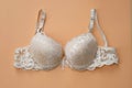 Beige female bra with push up top view.