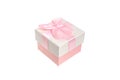 Beige gift box with a delicate pink engagement bow. Present for a birthday holiday, a Christmas event and a romantic greeting. Royalty Free Stock Photo