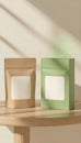 Beige and green packaging mockups sit on a light wood table. Royalty Free Stock Photo