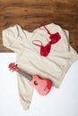 Beige hoodie and red brassiere flat lay Royalty Free Stock Photo