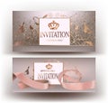 Beige invitation cards with beautiful design elements and ribbon.