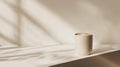 Beige Latte Cup in Soft Sunlight on White Surface Royalty Free Stock Photo