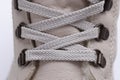 Beige leather boot with laces up closeup Royalty Free Stock Photo