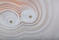 Beige light waves in agate macro structure Royalty Free Stock Photo