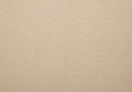 A beige linen texture fills the image, showcasing a fine, uniform weave. The material exhibits a Royalty Free Stock Photo